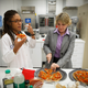 Michele Perchonok (right) trying a pizza recipe intended for Mars.